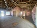 Unfinished living room featuring unfinished walls, bare concrete floors and natural light at 8183 Kerl Rd., Conway, SC 29526