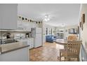 Clean and bright kitchen with white cabinets and modern appliances at 9560 Shore Dr. # 3A, Myrtle Beach, SC 29572