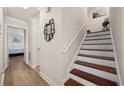 Elegant staircase with hardwood treads and white risers at 1023 Marthas Way, North Myrtle Beach, SC 29582