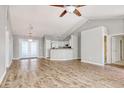 Open concept living area with kitchen, vaulted ceiling, and hardwood floors at 104 Osprey Cove Loop, Myrtle Beach, SC 29588