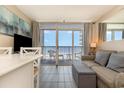 Living room with ocean view and balcony access at 161 Seawatch Dr. # 610, Myrtle Beach, SC 29572