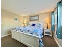 Bright bedroom with a queen-size bed and beach theme at 1906 S Ocean Blvd. # 108A, Myrtle Beach, SC 29577