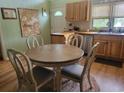 Round dining table with four chairs situated in a cozy kitchen area at 2228 Oyster Cove, Murrells Inlet, SC 29576