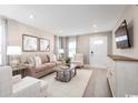 Bright living room featuring hardwood floors and comfortable seating at 273 Bent Green Ct. # 76G, Murrells Inlet, SC 29576