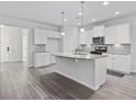 Modern kitchen with white cabinets and granite island at 2871 Ellesmere Circle, Myrtle Beach, SC 29579