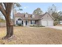 House exterior showcasing landscaping and driveway at 320 Muirfield Rd., Myrtle Beach, SC 29588