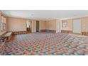 Spacious common area with built-in seating and colorful patterned carpet at 45 Steve Carmichael Rd., Hemingway, SC 29554