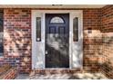 Dark wood front door with sidelights and arched window at 47 Byers Trail, Pawleys Island, SC 29585