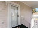 Exterior condo entrance with white door and small porch at 4781 Wild Iris Dr. # 304, Myrtle Beach, SC 29577