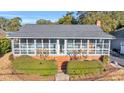 One story home with a large screened porch at 5515 Porcher Dr., Myrtle Beach, SC 29577