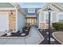 Welcoming front entry with walkway and landscaping at 569 Miromar Way, Myrtle Beach, SC 29588