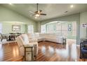 Spacious living room with hardwood floors, neutral walls, and sectional sofa at 569 Miromar Way, Myrtle Beach, SC 29588