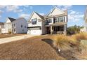 Two-story house with a large front yard and attached garage at 771 Flowering Branch Ave., Little River, SC 29566