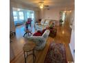 Open living area with hardwood floors and ample seating at 8650 Southbridge Dr. # A, Surfside Beach, SC 29575