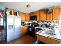 Galley kitchen with wood cabinets and stainless steel appliances at 916 Maple St., Mullins, SC 29574