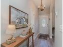 Bright and airy entryway with a console table and elegant decor at 9815 W Highway 19, Loris, SC 29569