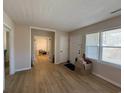 Inviting entryway featuring wood floors, a foyer, and French doors leading to another room at 10 Buckthorn St., Andrews, SC 29510