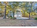 Two-car garage with concrete driveway and ample backyard space at 101 Bent Tree Ln., Pawleys Island, SC 29585