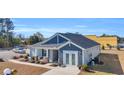 New construction home with gray and blue siding at 109 Foxford Dr., Conway, SC 29526