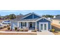 Gray and blue siding house with double front doors at 109 Foxford Dr., Conway, SC 29526