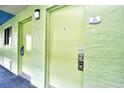 Hallway view of apartment doors and painted walls, complete with unit number at 1105 S Ocean Blvd. # 516, Myrtle Beach, SC 29577