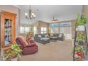 Cozy living room featuring a sectional sofa and large windows at 113 Barn Owl Ct., Carolina Shores, NC 28467