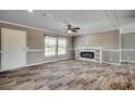 Living room with wood-look floors, fireplace, and ceiling fan at 122 Willie Mays Pl., Aynor, SC 29511