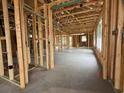 Interior framing of a new home showing the studs, electrical wiring, and window openings at 1245 Lady Bird Way, North Myrtle Beach, SC 29582