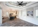 Bright and airy living room with hardwood floors and a ceiling fan at 132 Serenity Point Dr., Little River, SC 29566