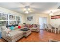 Living room and dining area with sectional sofa and glass dining table at 1350 Mcmaster Dr. # C, Myrtle Beach, SC 29575