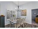 Bright dining room with farmhouse table and chandelier at 1420 Jardine Loop, Little River, SC 29566