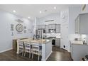 Modern kitchen with stainless steel appliances and granite island at 1420 Jardine Loop, Little River, SC 29566