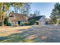 Ranch-style home with stone facade and large backyard at 1751 Gibson Ave., Surfside Beach, SC 29575