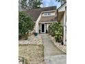 Welcoming front entrance with stone pathway and landscaping at 1751 Gibson Ave., Surfside Beach, SC 29575