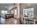 Open concept dining area, hardwood floors, view of living room and kitchen at 1811 Berkley Village Loop, Myrtle Beach, SC 29579