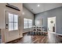 Bright dining area with hardwood floors and a view into a living room at 1811 Berkley Village Loop, Myrtle Beach, SC 29579