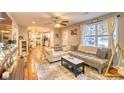 Open living room with hardwood floors and a view into the kitchen at 1900 Allston St., Georgetown, SC 29440