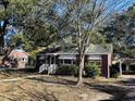 Ranch home with large trees and carport at 1916 Calhoun St., Georgetown, SC 29440