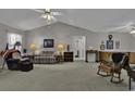 Spacious living room with vaulted ceiling, carpet flooring, and ample natural light at 3035 Dewberry Dr., Conway, SC 29527