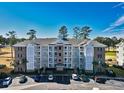 Condo building with brick exterior and balconies at 4886 Luster Leaf Circle # 404, Myrtle Beach, SC 29577