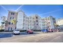 Brick condo building with ample parking at 4886 Luster Leaf Circle # 404, Myrtle Beach, SC 29577