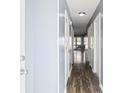 Light gray hallway with wood-look floors at 500 Fairway Village Dr. # 7-F, Myrtle Beach, SC 29588