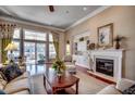 Bright living room with a fireplace, large windows and access to a patio at 58 Long Creek Dr., Murrells Inlet, SC 29576