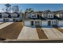 Townhome community view, showcasing a two-story house with a green roof at 592 Sea Sparrow St., Myrtle Beach, SC 29588