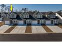 Row of townhouses viewed from above, showcasing uniform design and landscaping at 592 Sea Sparrow St., Myrtle Beach, SC 29588