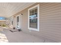 Inviting front porch with seating and potted plants at 6803 E Highway 19, Loris, SC 29569