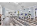 Inviting living room with open layout to the kitchen and modern wood flooring at 820 9Th Ave. S, North Myrtle Beach, SC 29582