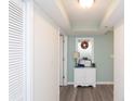 Bright entryway with white cabinet and coastal decor at 8560 Queensway Blvd. # 706, Myrtle Beach, SC 29572