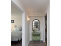 Hallway with green accent wall and access to bedroom and bath at 8560 Queensway Blvd. # 706, Myrtle Beach, SC 29572