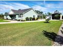 This property features a well maintained lawn, outbuilding, and shed at 926 Eula Dr., Conway, SC 29526